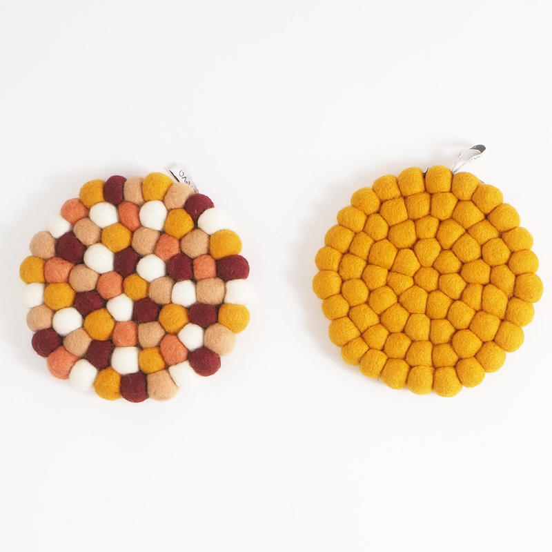 Trivets in wool in different mixed colors.