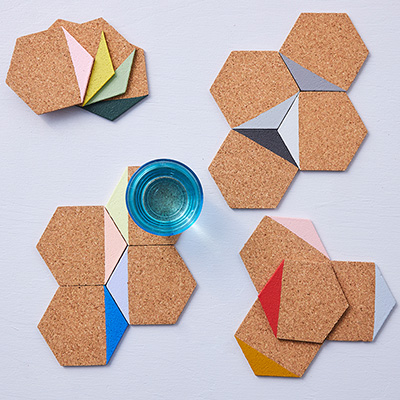 Coasters in light cork dipped in different colors such as pink, green, blue.