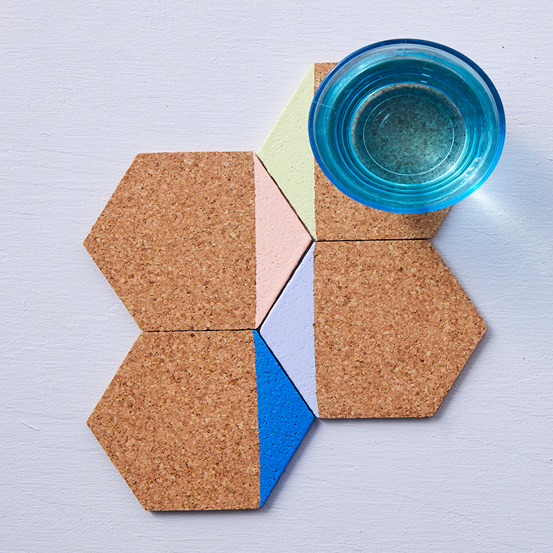 Coasters in light cork dipped in different colors such as pink, green, blue.