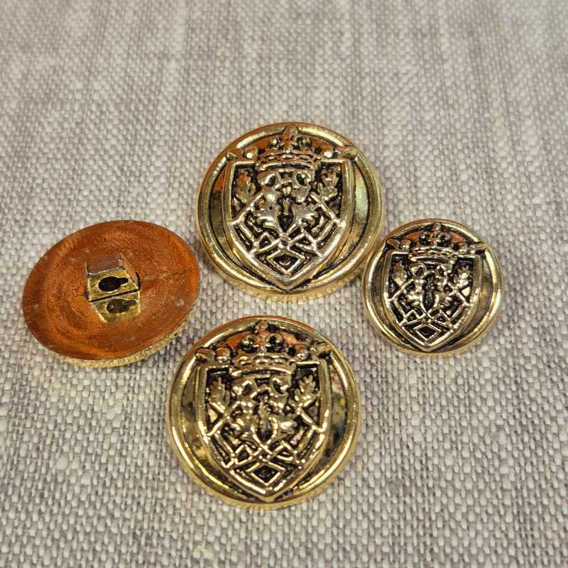 Pläterad plastknapp – Guld, Sköldmotiv