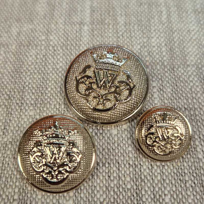 Pläterad plastknapp - Blekguld