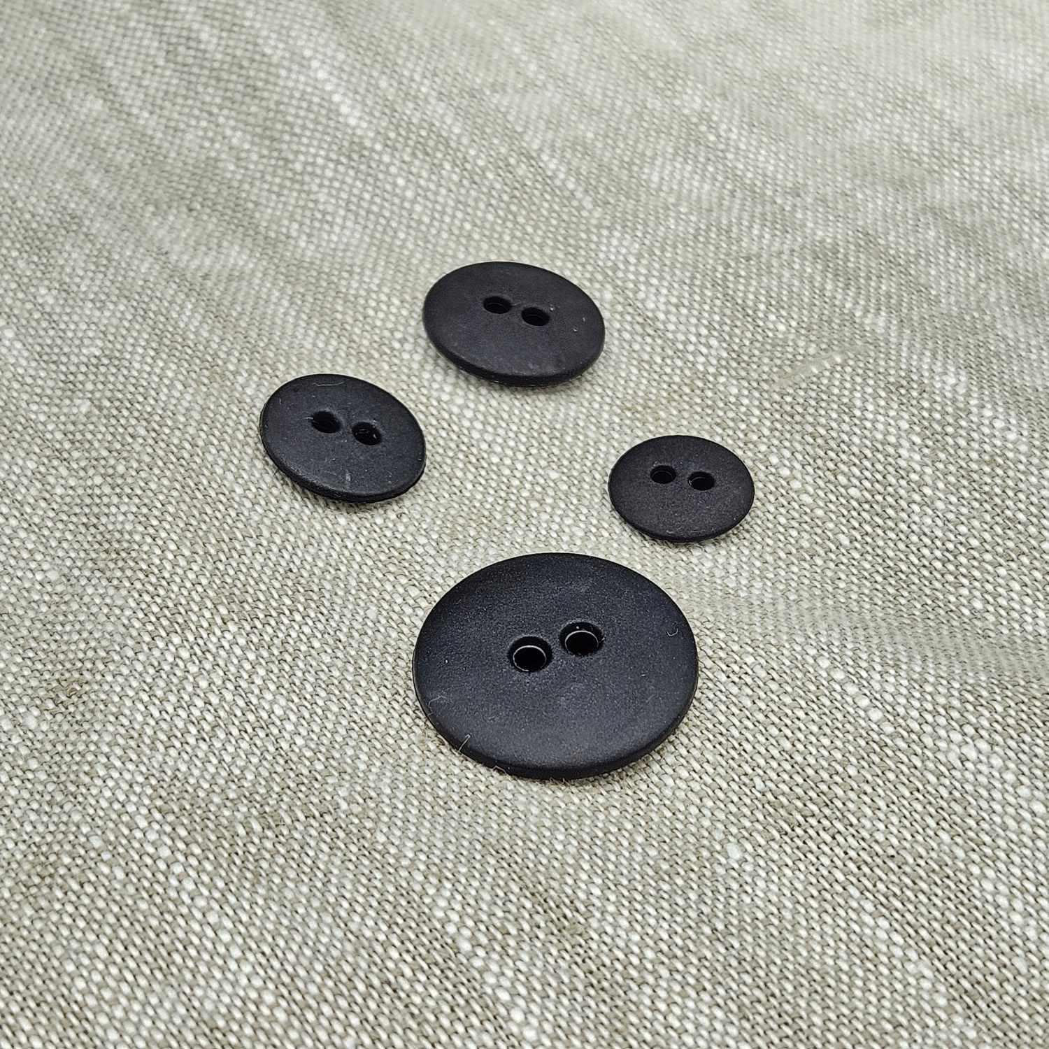 Plastknapp med 2 hål