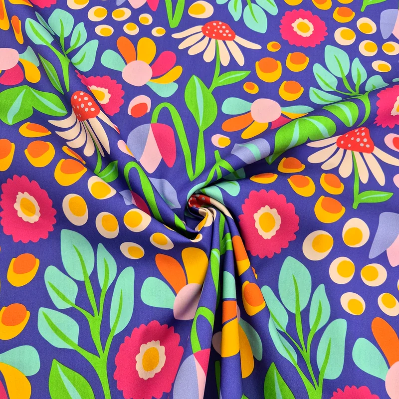 Bomullspoplin med färgglada blommor, 145 cm, 115 g/m²