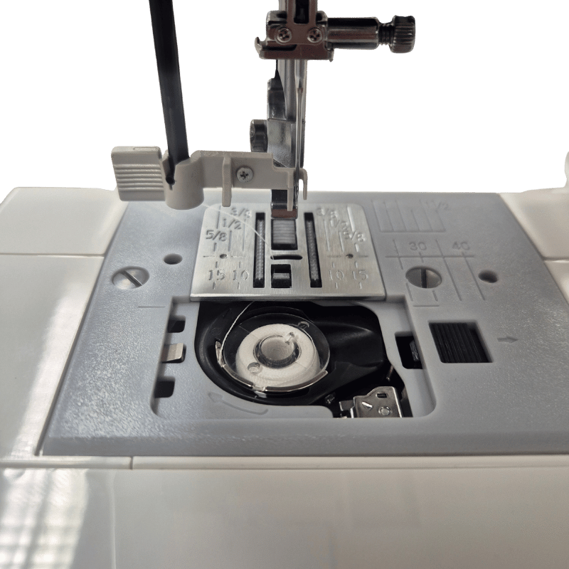 Liggande spole, nålpåträdare och 4-delad matare på Driva