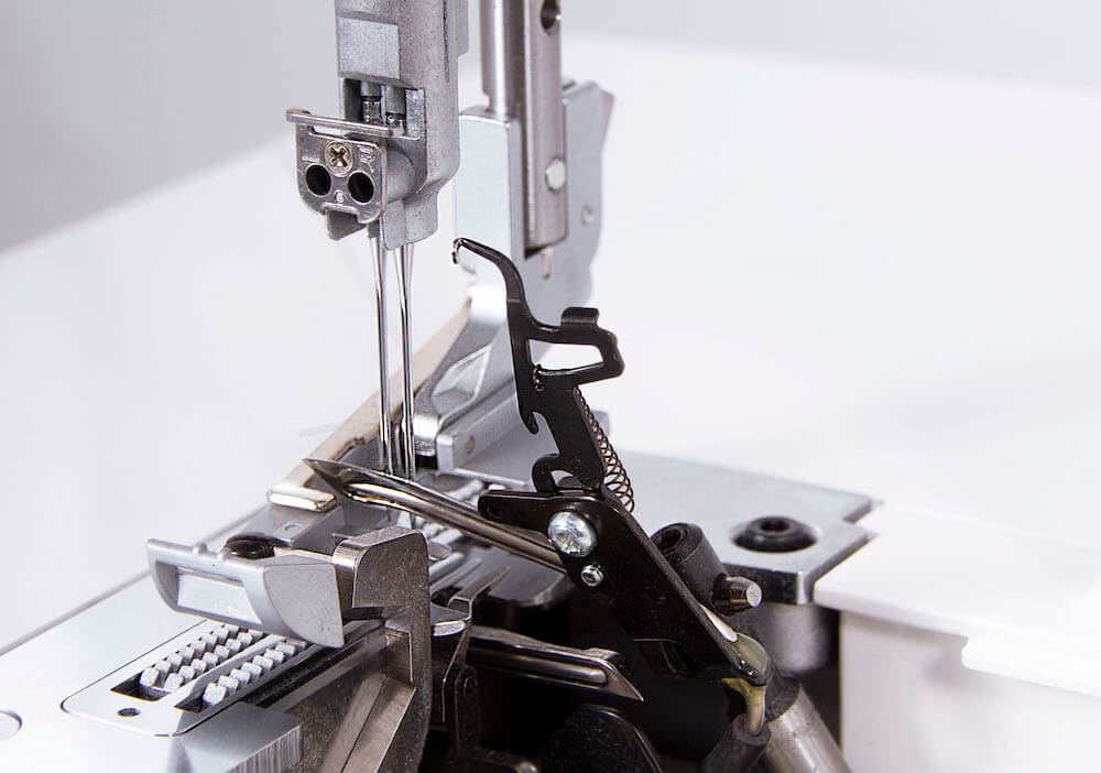 2-tråds omvandlare på Baby Lock Victory för flatlock och rullfåll