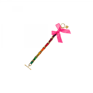 Regnbågsfärgat armband för barn i slike med rosa rosett 24K guldpläterade länkar. Design av Bjällra of Sweden.