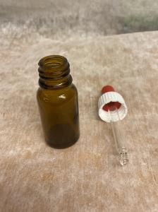 Glasflaska med pipett 