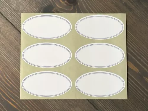 Etikett Oval, Vit med blå kant (6 st / ark)