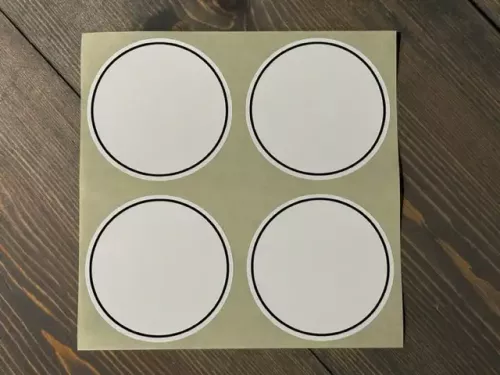 Etikett Rund med svart ram Stor (4 st / ark)