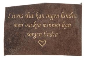Skiffersten med graverad text i guld: Livets slut...