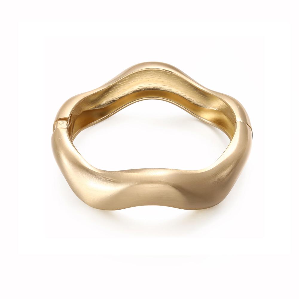 Armband, Guldfärgat stelt med böljande form - Gemini