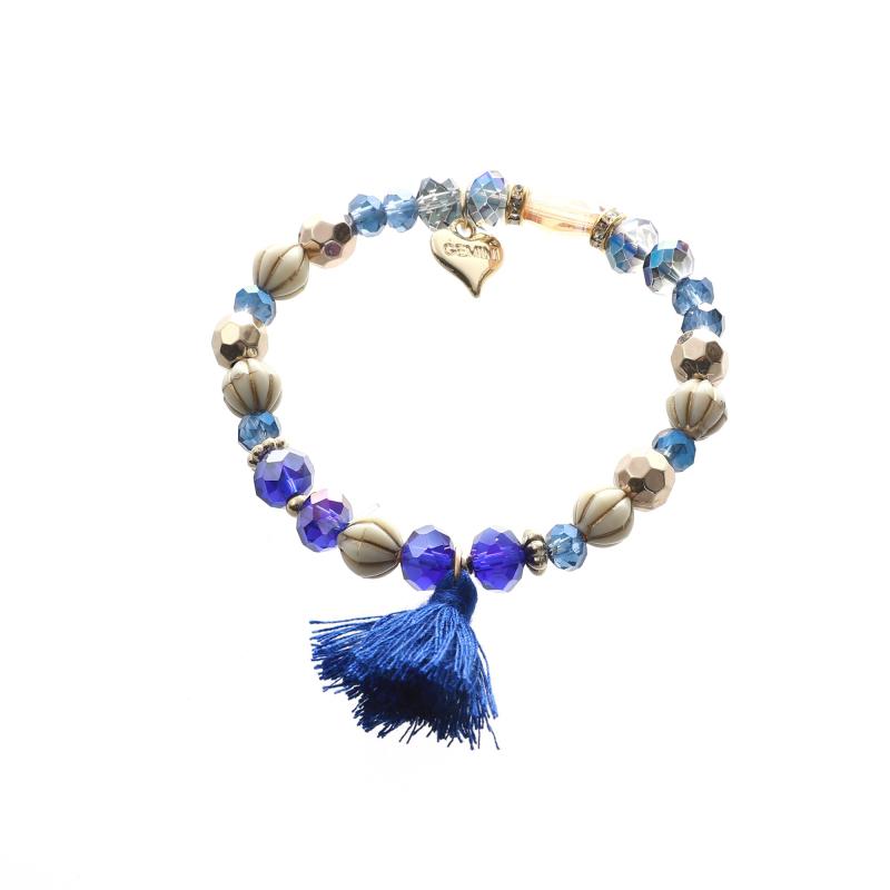 Armband med pärlor i olika blå nyanser samt tofs, Elastiskt - Gemini