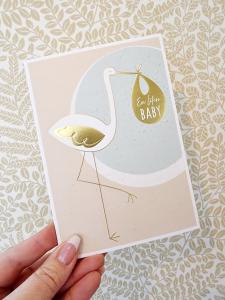 En liten baby - dubbelt kort med en stork, Pictura