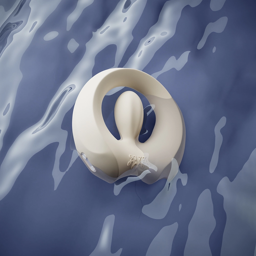 Valkoinen APIS-värisevä penisrengas (ZALO) sinisessä vedessä – vedenkestävä, vain Chambers of Lovelta.