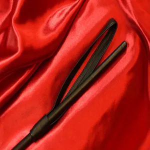 Close-up of the handle of exclusive leather-covered BDSM fiber cane from Chambers of Love.