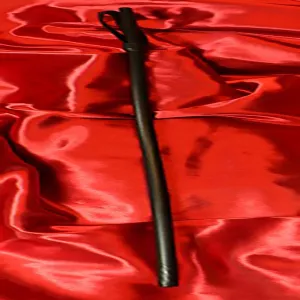 Exclusive leather-covered fiber cane from Chambers of Love – for intense BDSM and discipline sessions.