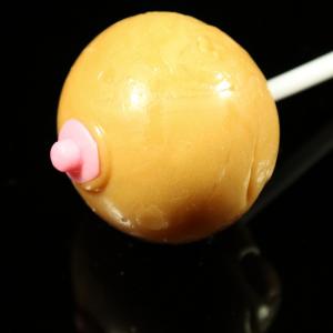 Close-up of Boobie Pop Nipply. Breast-shaped strawberry-flavoured lollipop from Chambers of Love, perfect as a fun gift or for a stag party.