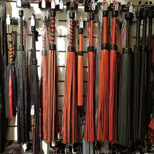 Flogger family – exclusive selection of floggers and whips in suede, genuine leather, vegan material, and silicone, displayed in-store for maximum variety and quality during BDSM sessions from Chambers of Love.