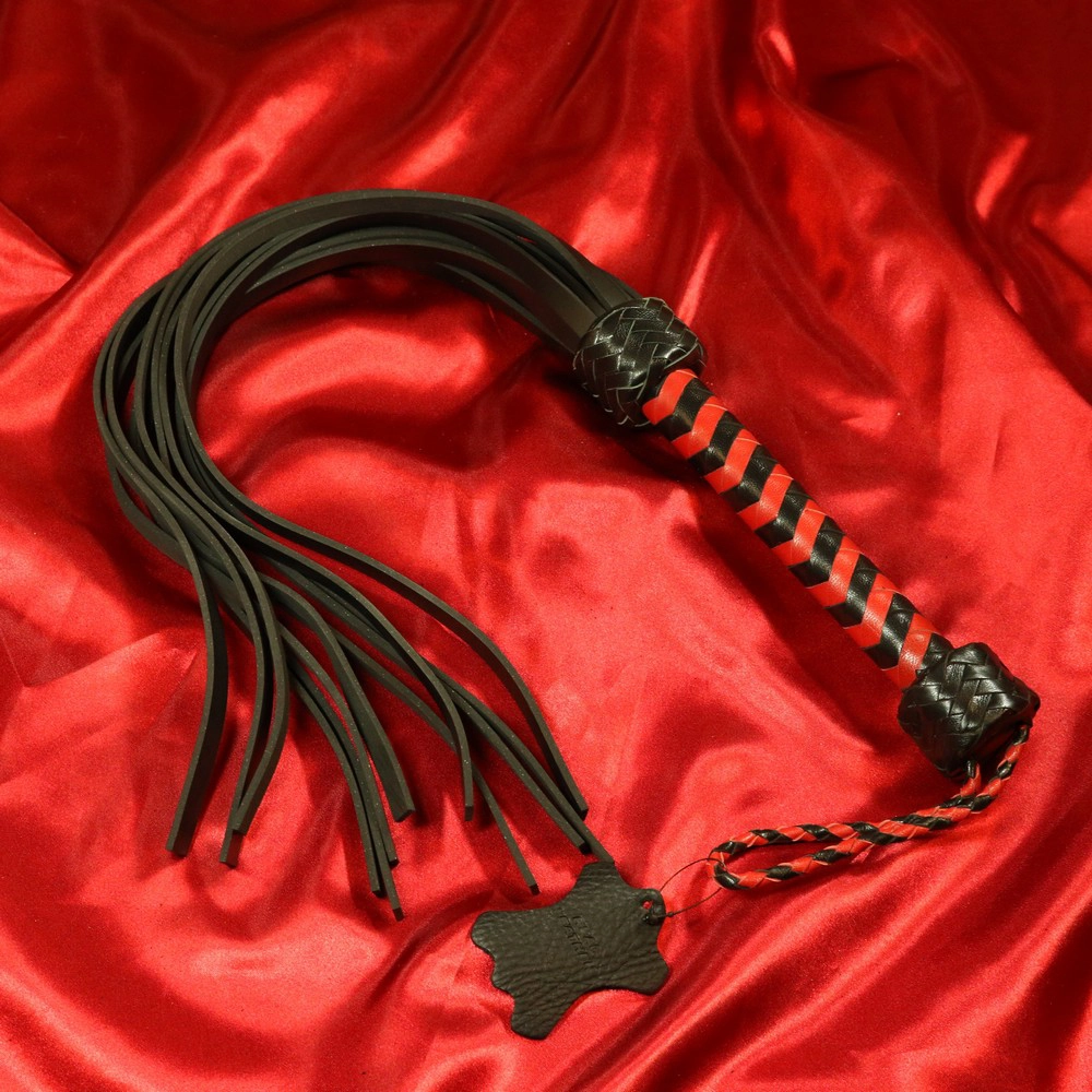 Rubber flogger in red and black from Chambers of Love, item number XA126RBL. Flexible and powerful design for intense BDSM sessions.