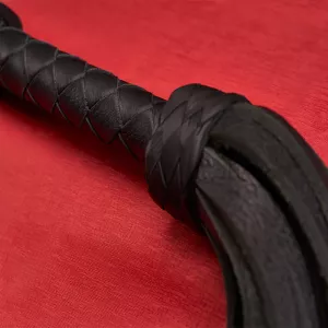 Close-up of the tail attachment on the Heavy Wide Flogger from Chambers of Love – robust and durable construction.