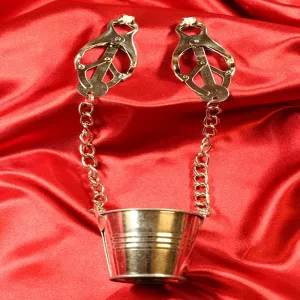 Japanese nipple clamps with metal bucket and chains – front view on red satin fabric from Chambers of Love
