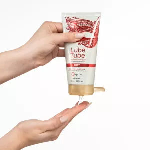 Hand letting Orgie Lube Tube Hot warming water based lubricant run over fingers from Chambers of Love.