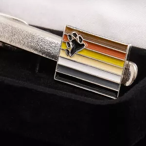 Detail shot of cufflinks with BEAR flag from Chambers of Love. Show your bear pride with style and elegance.