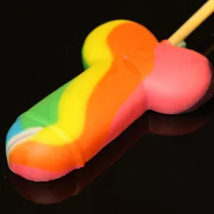 Close-up of penis-shaped lollipop in rainbow colors from Chambers of Love. Playful candy lollipop, perfect for Pride, bachelorette parties, or as a fun gift.