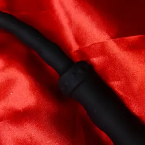 Close-up of the black handle on a silicone whip with beads, short single-tail model from Chambers of Love