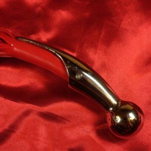 Close-up of the handle of the Silicone Flogger Silver Ball Red from Chambers of Love.