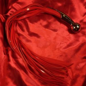 Silicone Flogger Silver Ball Red from Chambers of Love combines uncompromising power with elegant design for intense BDSM sessions.