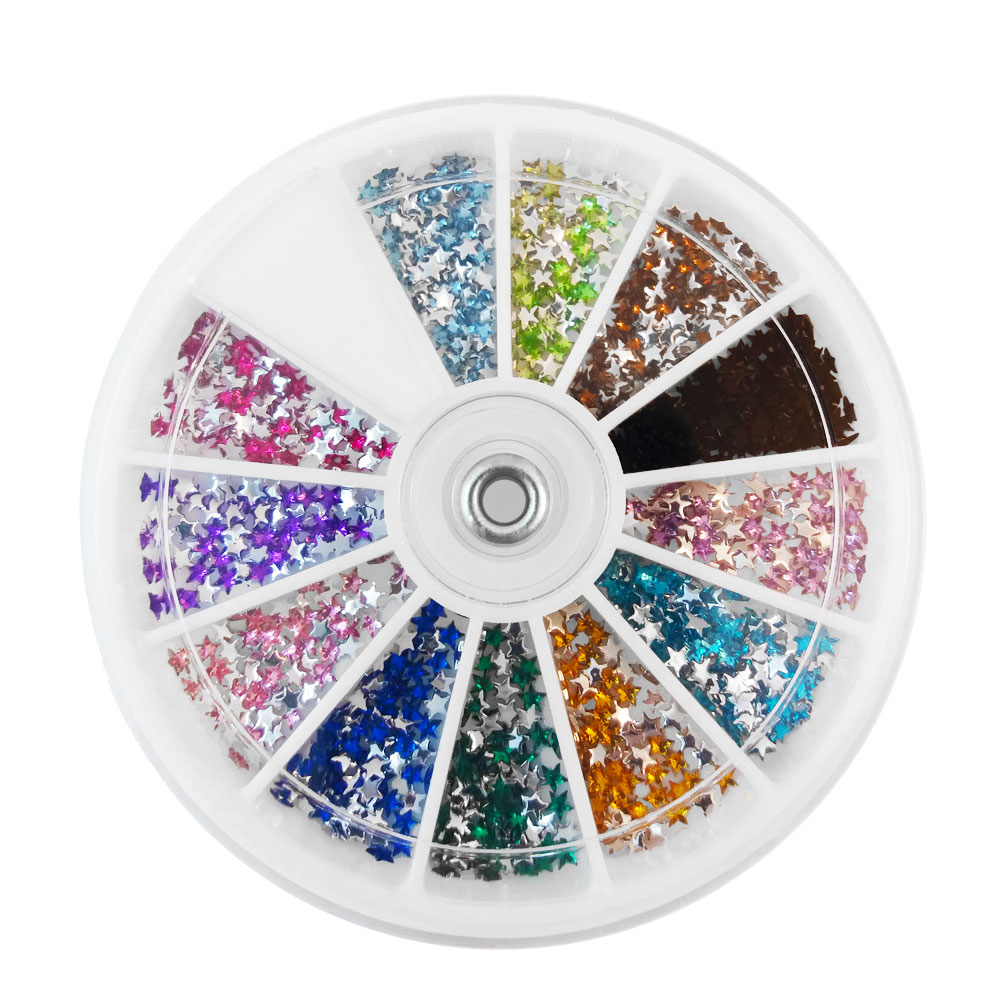 Vit dosa med stjärnformade nageldekorationer / strass / rhinestones i olika färger,  sorterade i 12 fack.