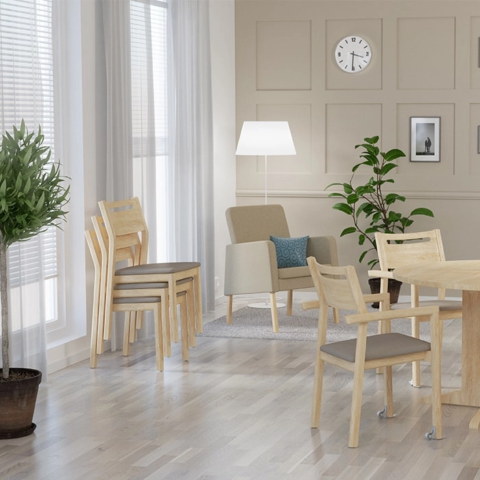 Alma stolar och karmstol med Clara fåtölj i en miljö.