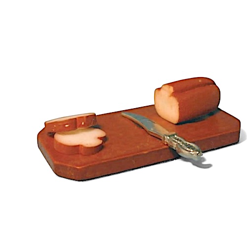 Bröd på skärbräda m kniv