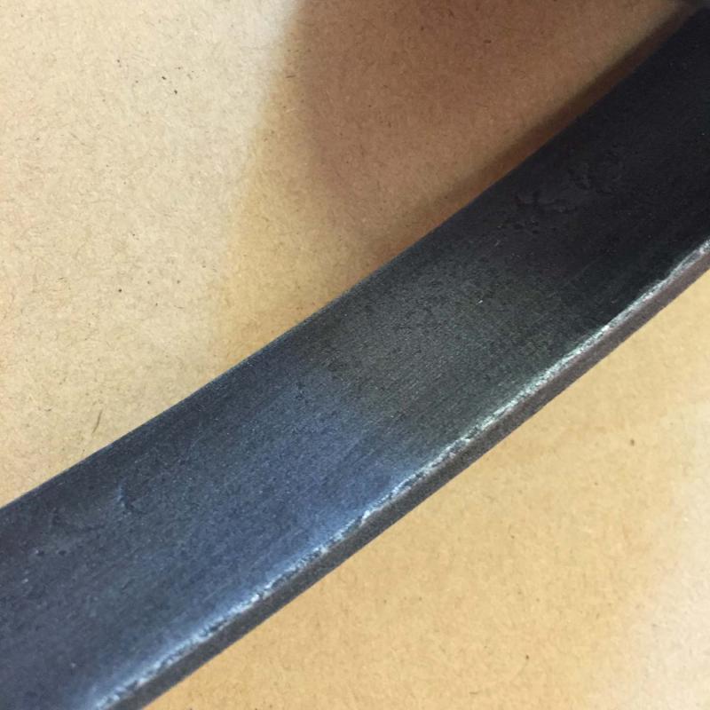 svart ljusring i smide – närbild