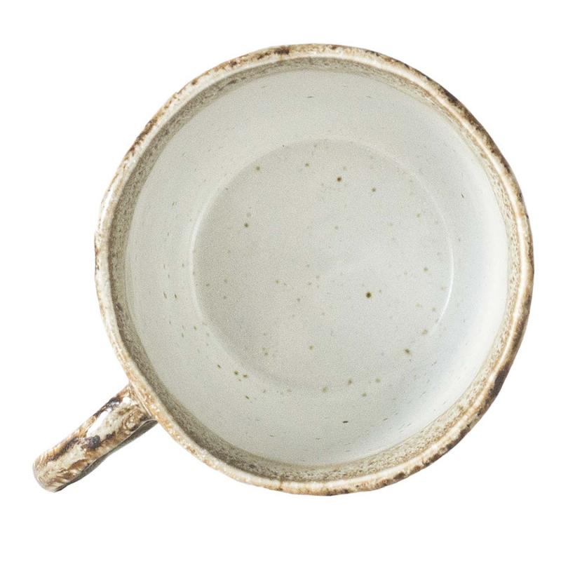 kopp ovanifrån i jordfärgad keramik