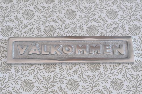 Skylt  VÄLKOMMEN