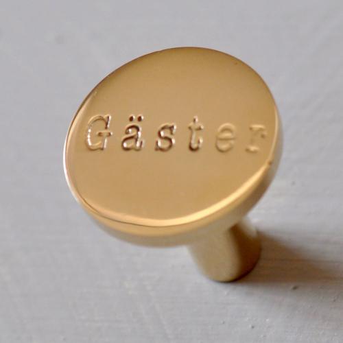 Gäster - krok i mässing