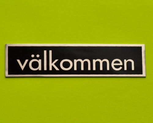 välkommen skylt