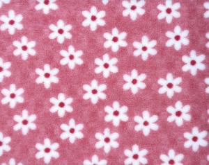 Vetbed Pebbles hundfäll, rosa med vita blommor. Med gummerad baksida.