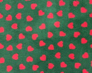 Vetbed hundfäll grön med röda hjärtan. Gummerad baksida.