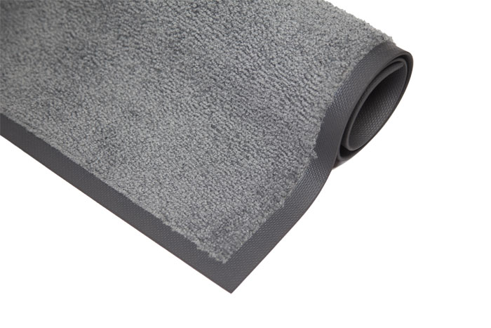 Ihoprullad torkmatta grå med en liten del utrullad