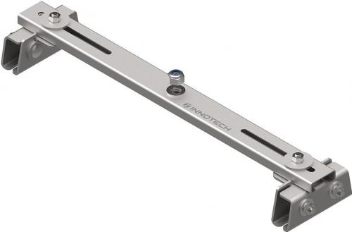 Intermediate base for standing seam roofs