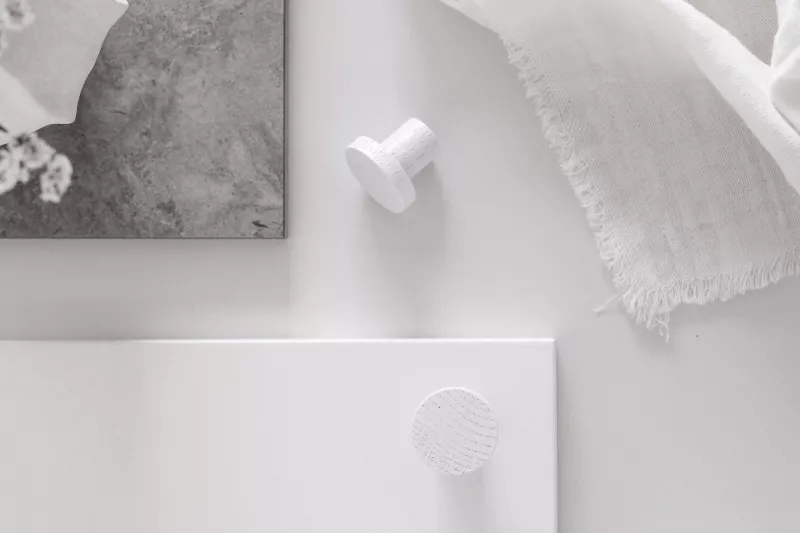 White-stained Yumi wooden knob among white interior details