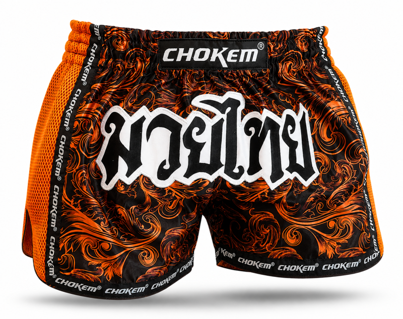 CHOKEM: NAK MUAY THAIBOXNINGSSHORTS - SVART/ORANGE