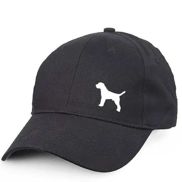 Keps med en Borderterrier