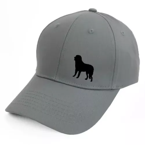 Keps med en Pyreneisk Mastiff