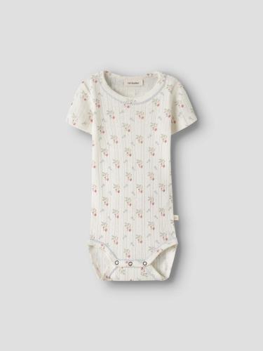 TRYCKT BODY pointelle med blommor