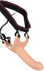 Ihålig Strap-On med sele, som ger ökad tjocklek och längd.