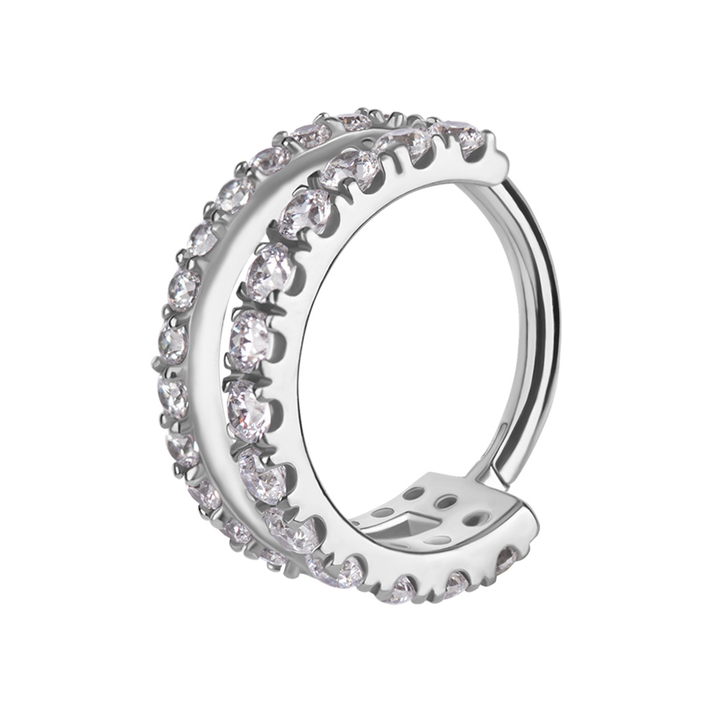 Piercingsmycke. Silvrig ring i dubbel design med vita kristaller.